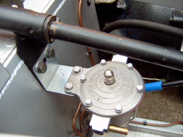 Fuel regulator and shared mounting with steering column.